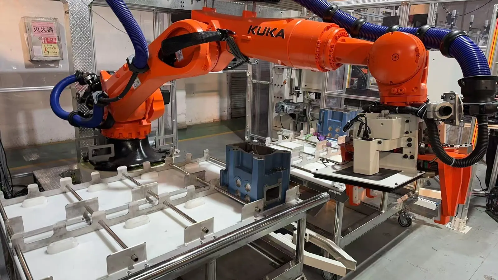 KUKA robot loading station for cylinder head assembly line automation