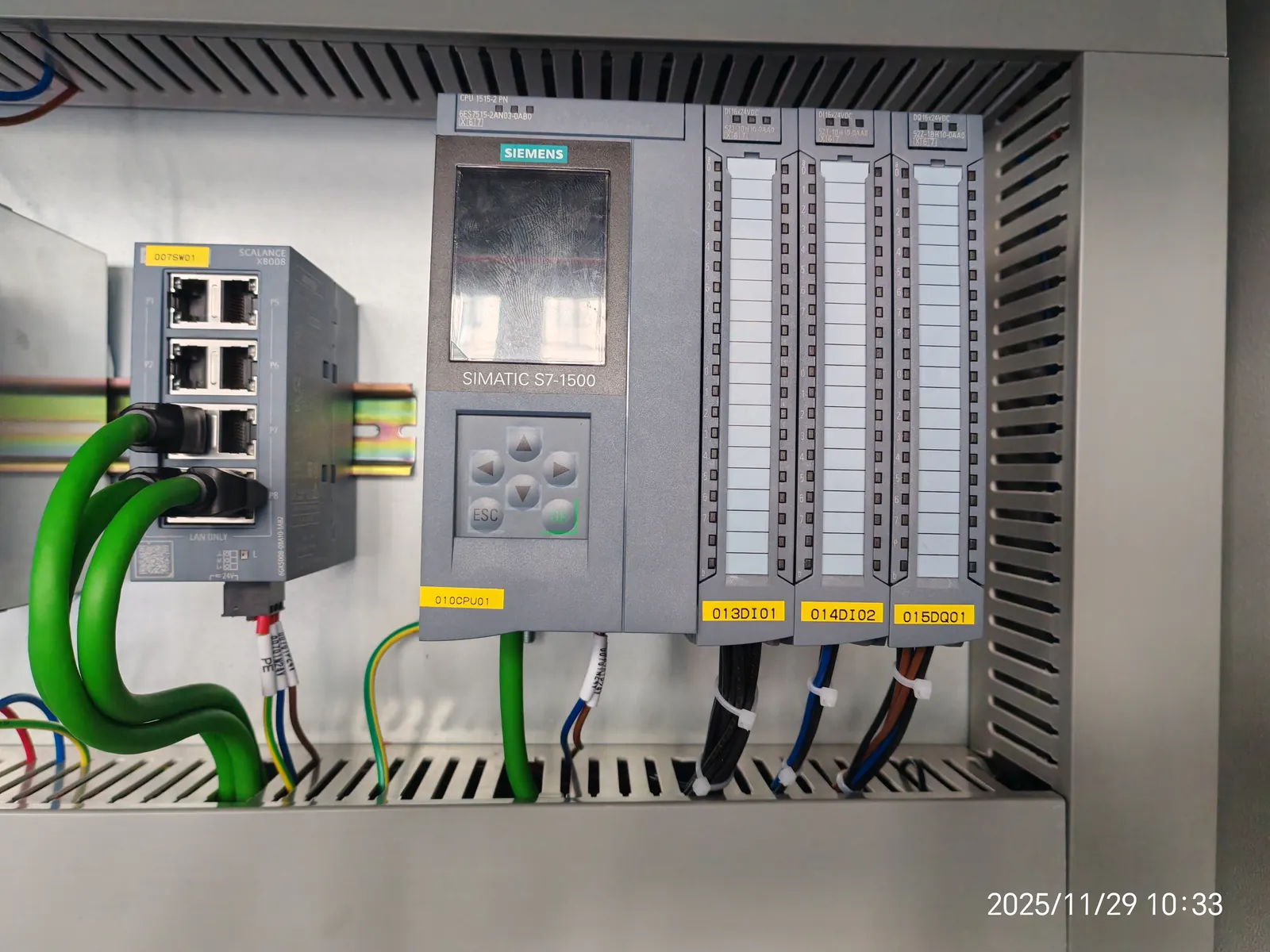 Siemens S7-1500 PLC and industrial switch inside control cabinet for engine assembly line